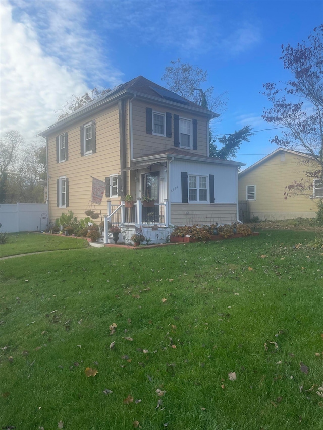 view of front of house featuring a porch and a front yard