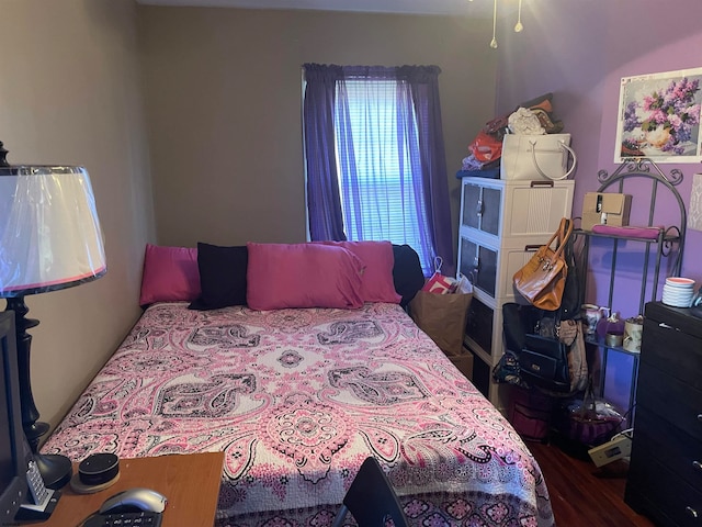 bedroom featuring hardwood / wood-style floors