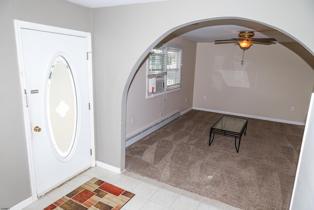 entryway featuring cooling unit, light carpet, ceiling fan, and a baseboard heating unit