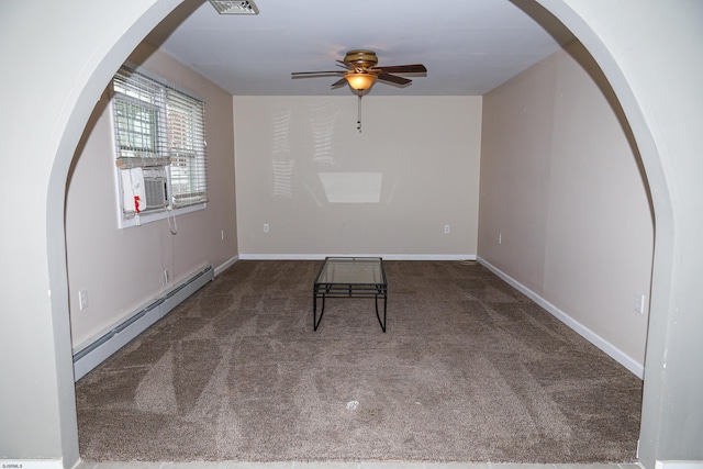 carpeted spare room featuring cooling unit, ceiling fan, and a baseboard heating unit