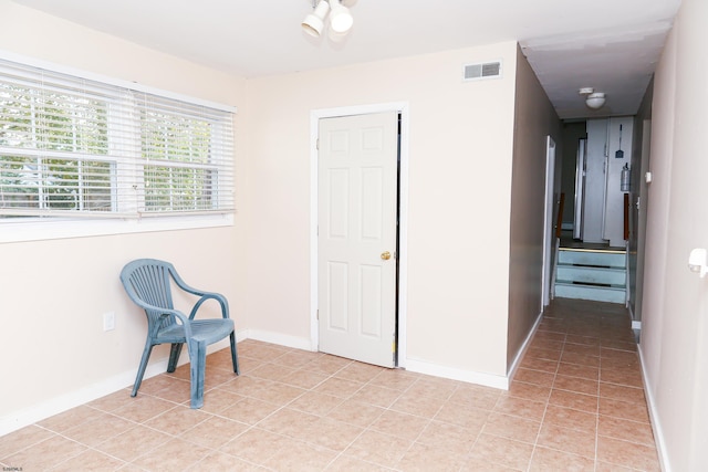 living area featuring light tile patterned floors