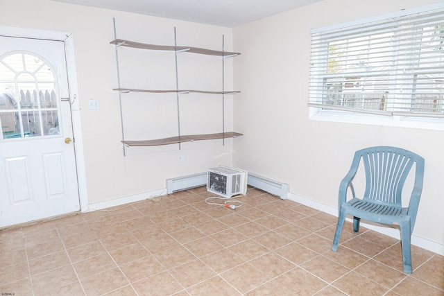 tiled foyer entrance with a wealth of natural light and a baseboard radiator