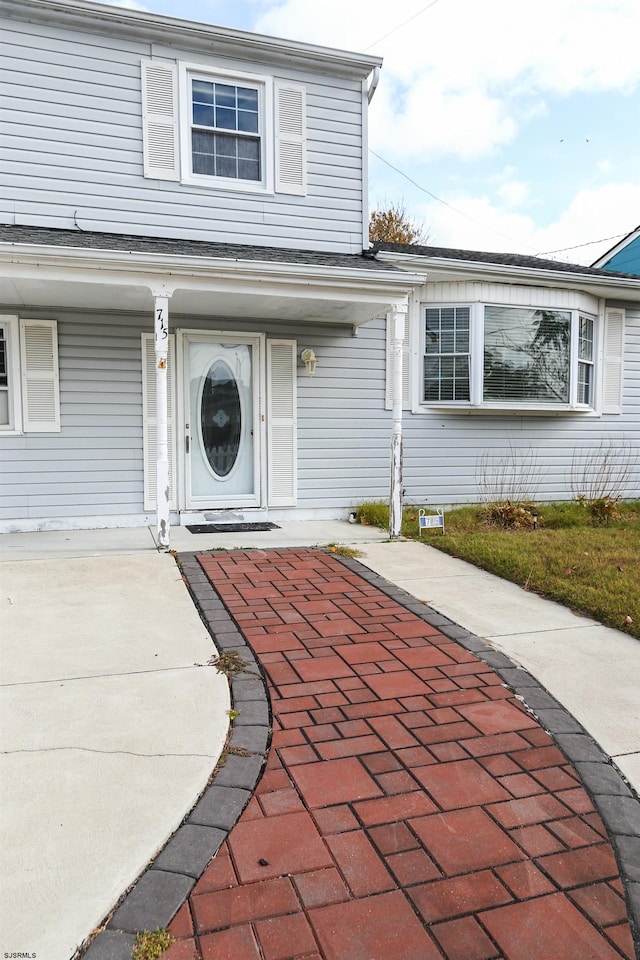 property entrance featuring covered porch