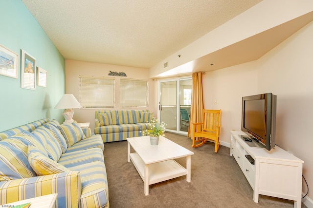 living room with a textured ceiling and carpet flooring