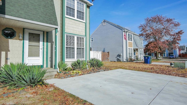 view of side of home featuring a patio