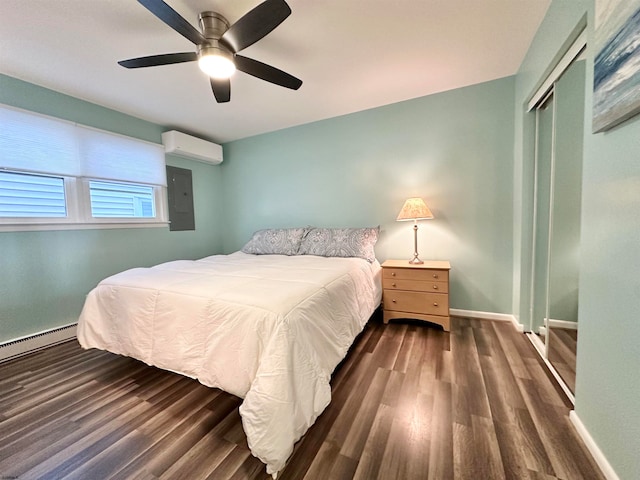 bedroom featuring electric panel, a wall mounted air conditioner, ceiling fan, dark wood-type flooring, and a closet