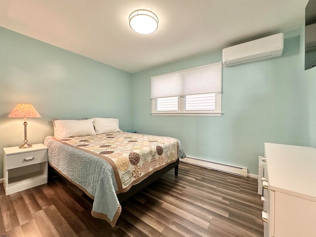 bedroom featuring a baseboard heating unit, dark wood-type flooring, and a wall mounted air conditioner