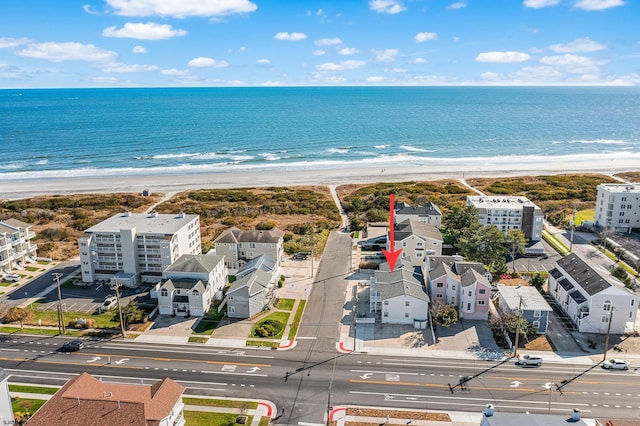 aerial view featuring a beach view and a water view