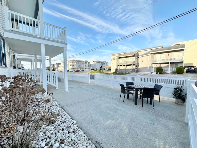 view of patio featuring a balcony