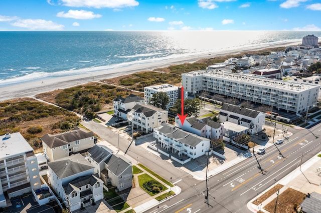 bird's eye view with a view of the beach and a water view