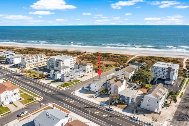 bird's eye view with a view of the beach and a water view