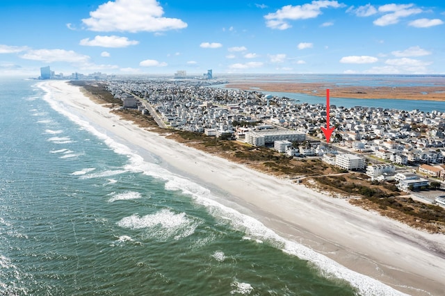 drone / aerial view with a view of the beach and a water view