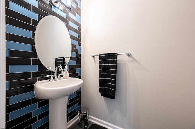 bathroom with tile walls and tasteful backsplash