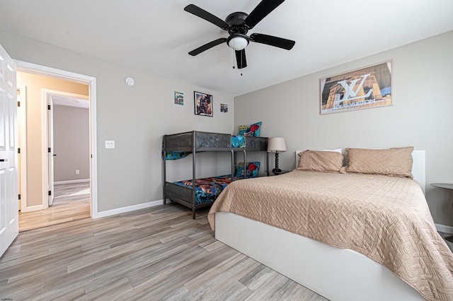 bedroom with ceiling fan and light wood-type flooring