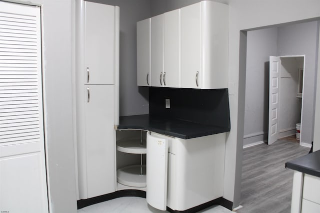 kitchen with white cabinetry and light wood-type flooring