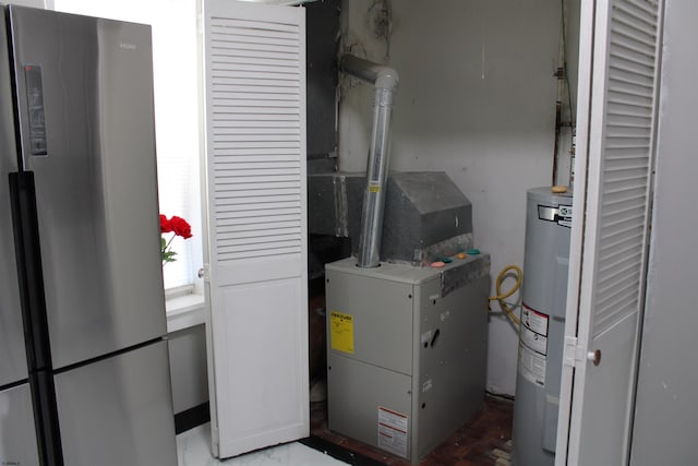 utility room featuring electric water heater