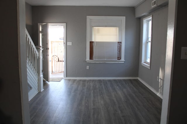 entrance foyer with dark hardwood / wood-style floors