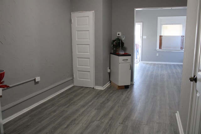 spare room featuring dark hardwood / wood-style floors