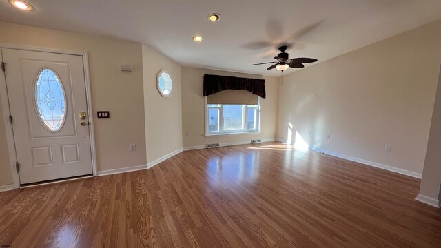 foyer featuring hardwood / wood-style flooring and ceiling fan