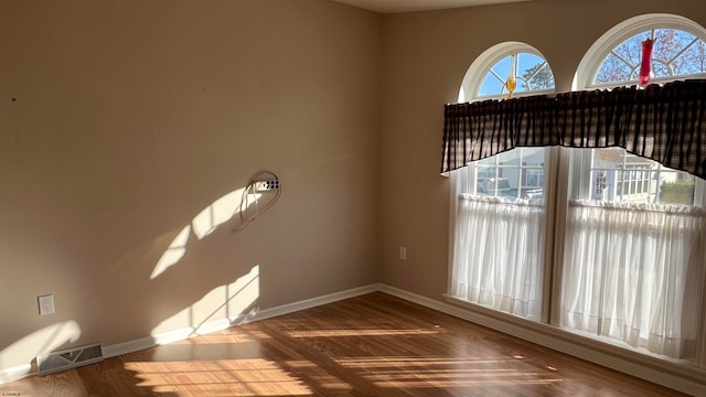 spare room featuring hardwood / wood-style floors