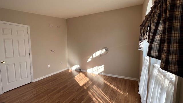 unfurnished bedroom featuring hardwood / wood-style flooring