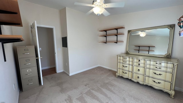 unfurnished bedroom with light colored carpet and ceiling fan