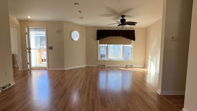 unfurnished room featuring wood-type flooring and ceiling fan