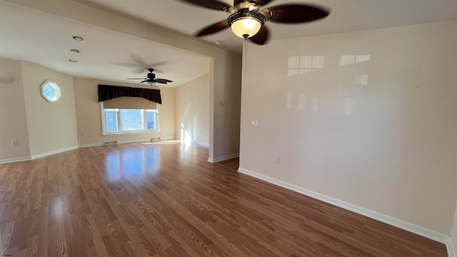 unfurnished living room featuring hardwood / wood-style floors and ceiling fan