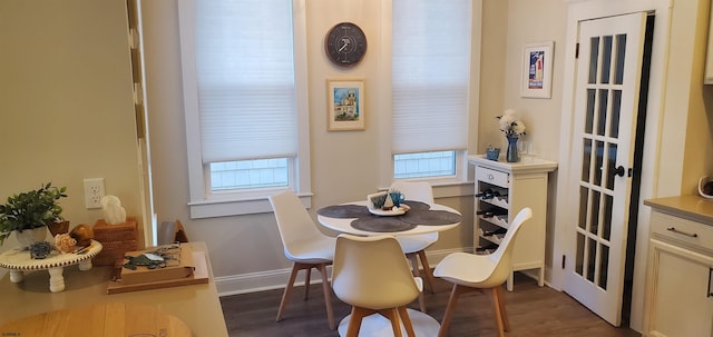 dining area featuring dark hardwood / wood-style flooring