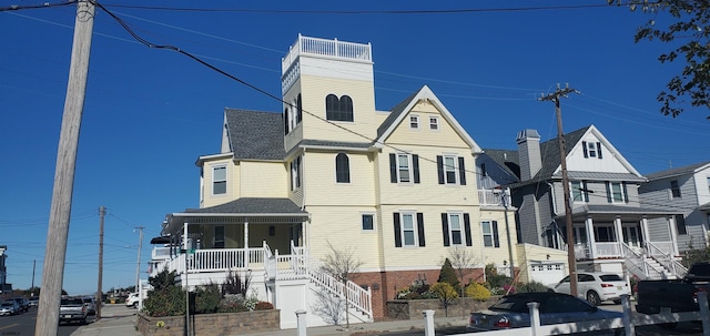 view of front facade featuring a garage and covered porch