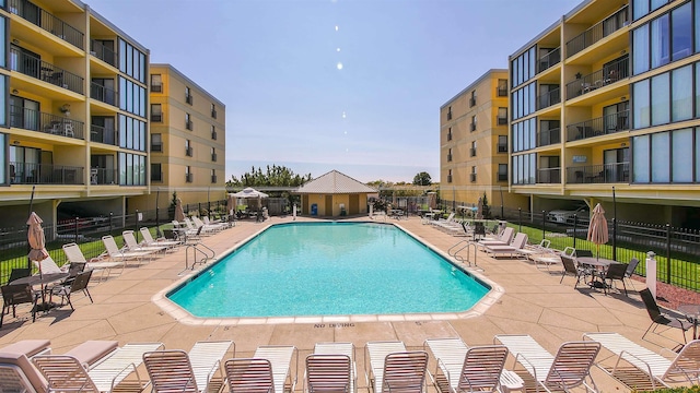 view of swimming pool with a patio