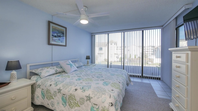 4540 W Brigantine Ave Unit N-102, Brigantine, NJ 08203 - bedroom featuring multiple windows, access to exterior, tile patterned floors, and a ceiling fan