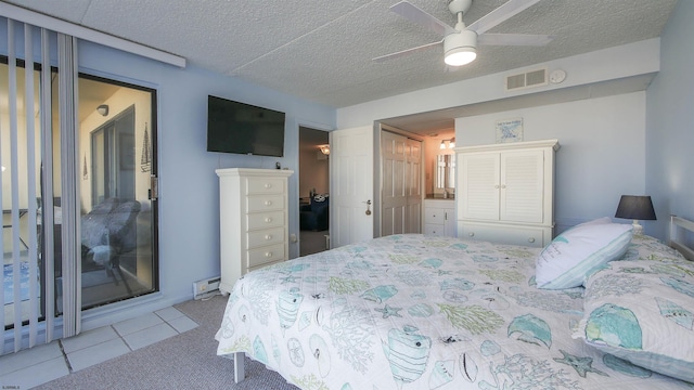 4540 W Brigantine Ave Unit N-102, Brigantine, NJ 08203 - bedroom with a textured ceiling, tile patterned floors, and a ceiling fan
