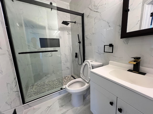 bathroom featuring walk in shower, vanity, toilet, and tile walls