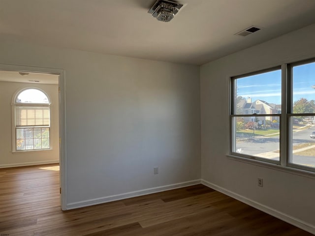 empty room featuring dark hardwood / wood-style floors