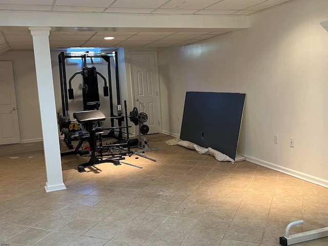 workout room featuring a drop ceiling