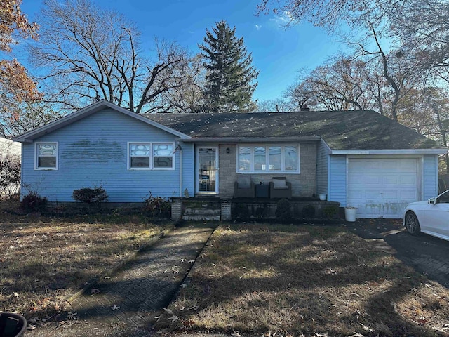 single story home with a garage