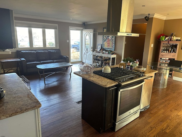 kitchen featuring island range hood, crown molding, a kitchen island, stainless steel gas range oven, and dark hardwood / wood-style flooring