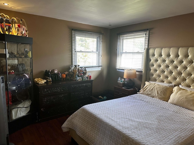 bedroom featuring dark hardwood / wood-style floors