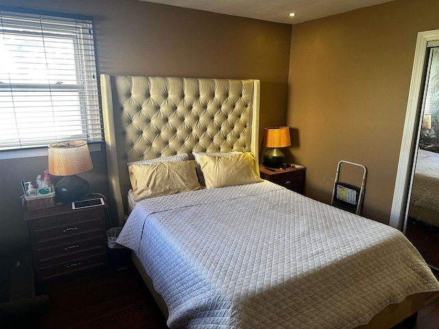 bedroom featuring dark wood-type flooring