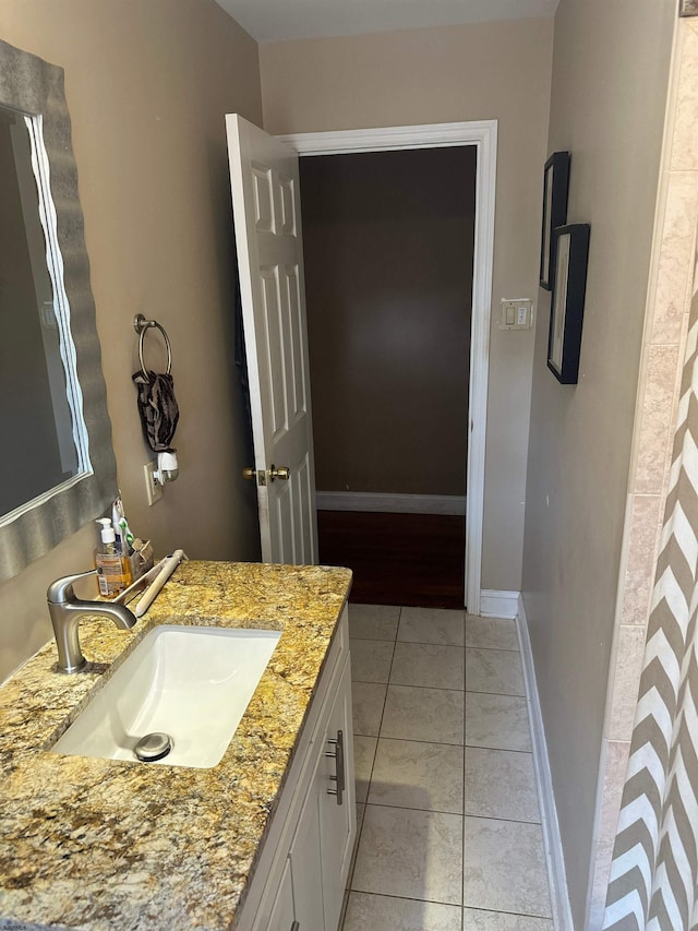 bathroom featuring vanity and tile patterned flooring