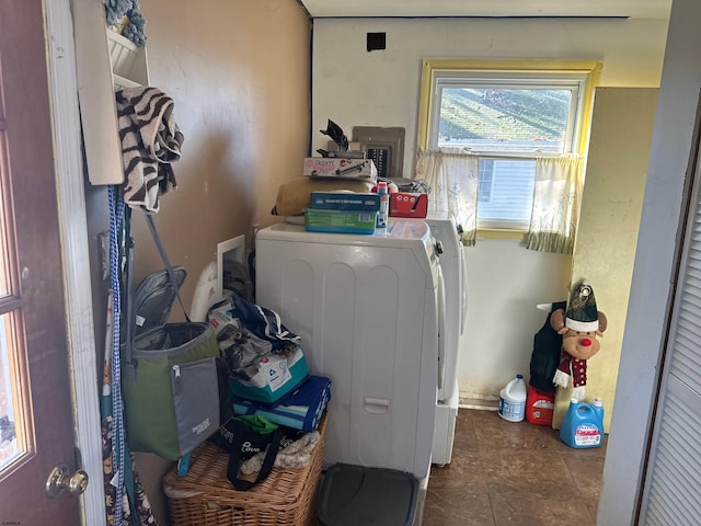 clothes washing area with electric panel and washer and clothes dryer