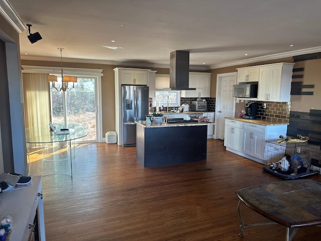 kitchen featuring stainless steel appliances, dark hardwood / wood-style flooring, island range hood, white cabinets, and hanging light fixtures