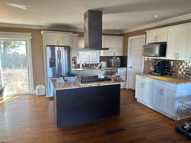 kitchen featuring island range hood, stainless steel appliances, white cabinetry, dark wood-type flooring, and a center island