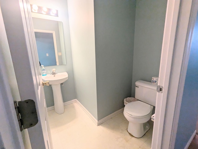 bathroom featuring toilet and sink