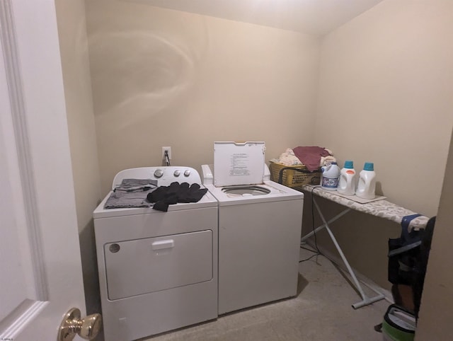 washroom with washer and dryer