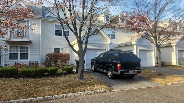 view of front facade with a balcony and a garage