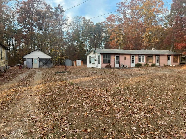 single story home featuring a storage unit