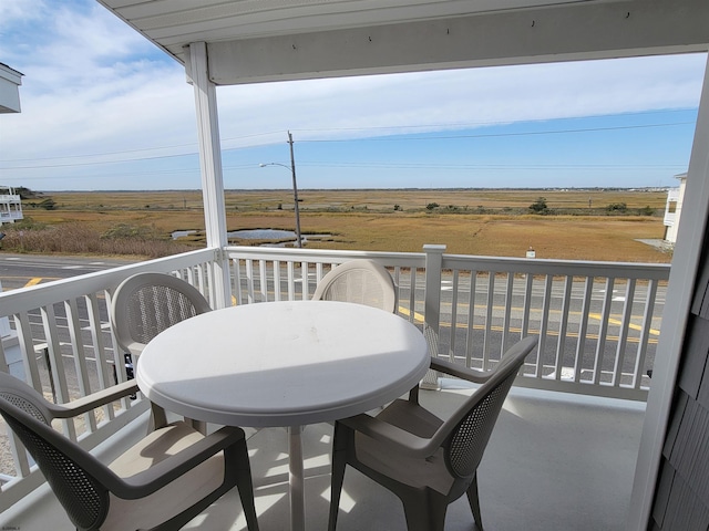 balcony featuring a rural view