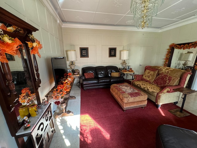 living room featuring a notable chandelier and ornamental molding